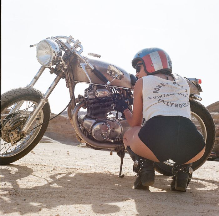 A playful frame from Girls on a motorcycle — online in Taiz